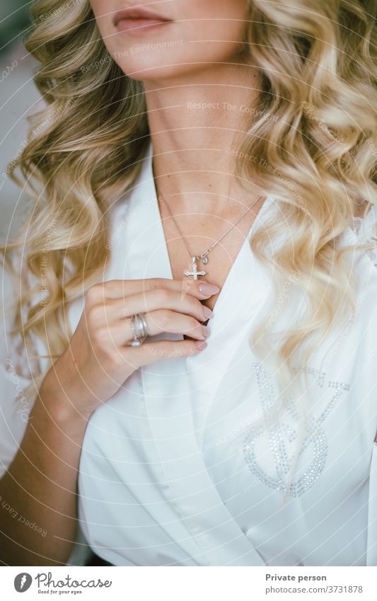 Close-up of a blonde girl wearing jewelry, bijoux and accessories. Choker woman glamor bride style fashion beauty sexy beautiful model luxury young makeup