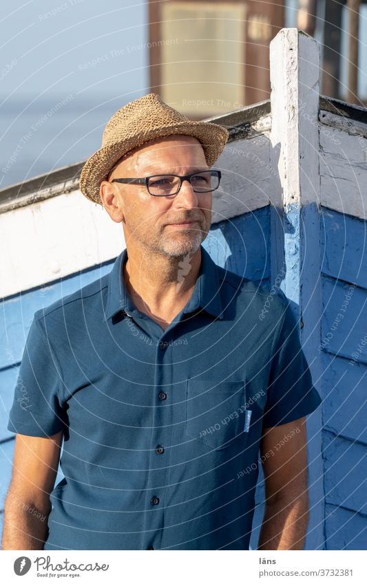 Man at the fishing boat portrait Fishing boat Beach Exterior shot Ocean coast Maritime Vacation & Travel Colour photo Baltic Sea Herigsdorf Straw hat