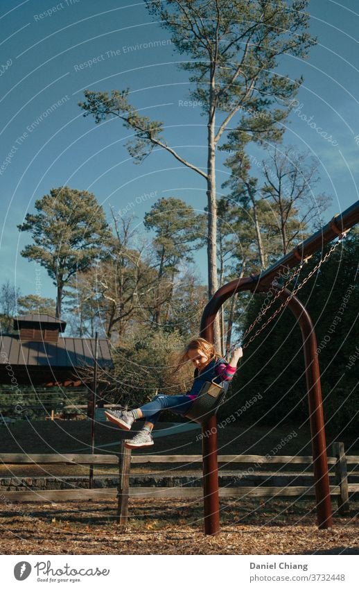 Little Girl Swing In The Park Child Joy To swing Playground Laughter Playing Infancy Life Winter cheerful child Exterior shot 1 Happiness laughing child