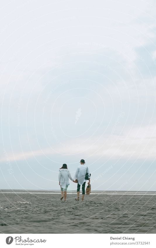 Couple Walking On The Beach Infatuation Related Harmonious Affection Trust Sandy beach Beautiful weather Lovers Together Travel photography Blue sky Hold hands