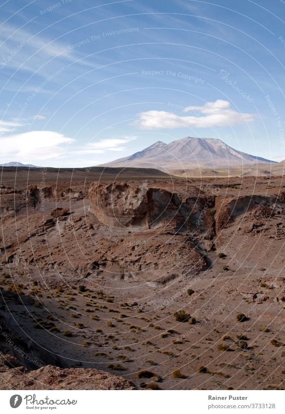 Rugged spectacular landscape in Salar de Uyuni, Bolivia adventure arid bolivia brown cloud desert dry hill mountain nature salar de uyuni sand scenery scenic