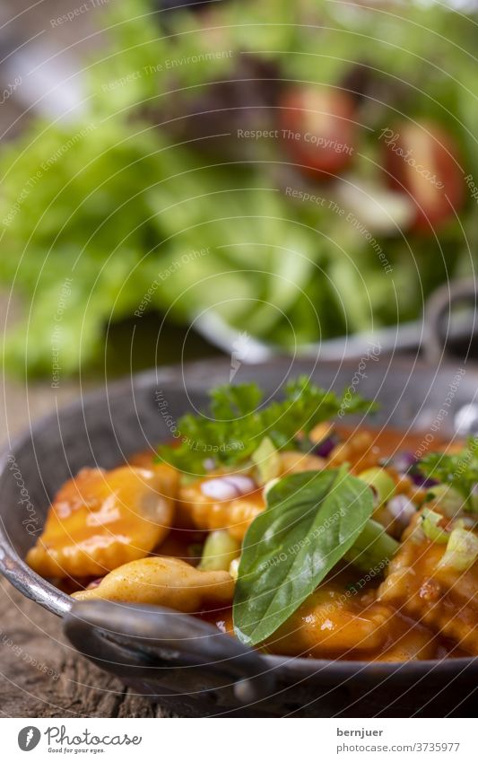 Ravioli in a copper casserole Bolognaise Bolognese Fresh salubriously Meal Eating Dinner Italian green herbaceous cake Diet Tortellini Vegetable Delicious