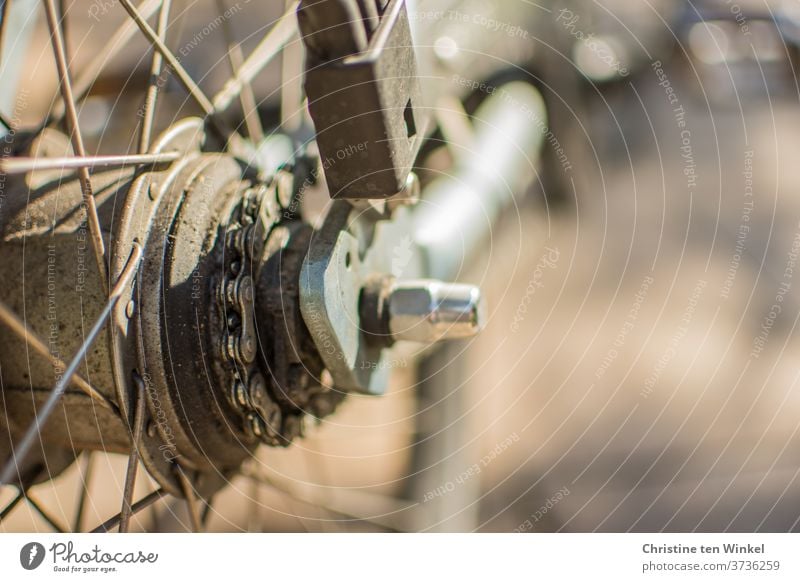 Bicycle. Close-up. Light. Shadow. Sunlight Detail Spokes Tire Glittering Reflection bicycle spokes bicycle hub Hub Chain Bicycle chain Old frowzy Wheel Metal