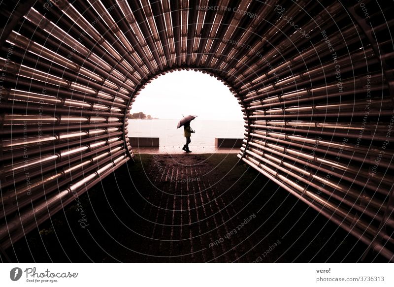 Umbrella Girl Tunnel Copy Space top Landscape format Copy Space left Copy Space right Creativity Uniqueness Copy Space bottom Central perspective Child Life