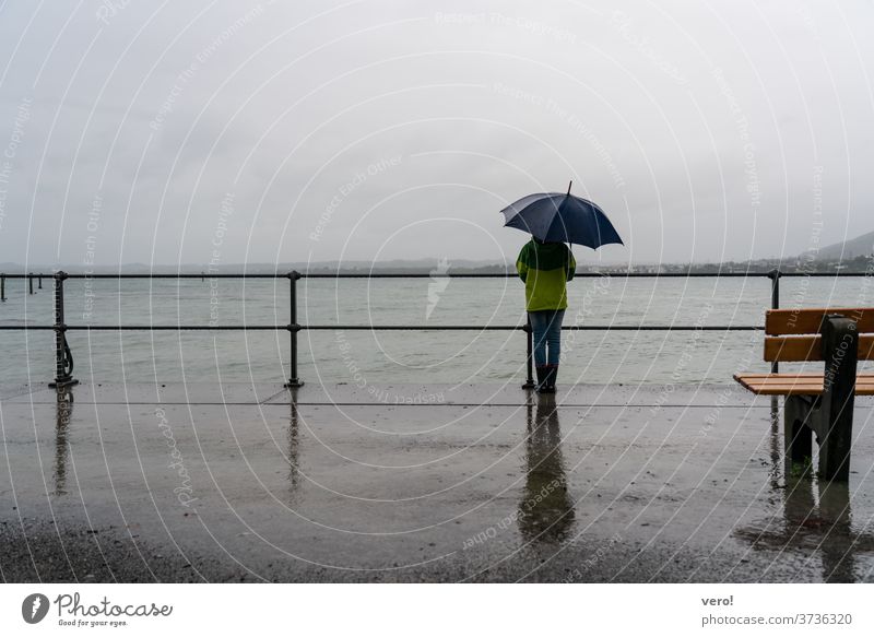 Sea umbrella rain promenade Copy Space top Landscape format Copy Space left Copy Space right Copy Space bottom Child Life Human being raindrop water Weather