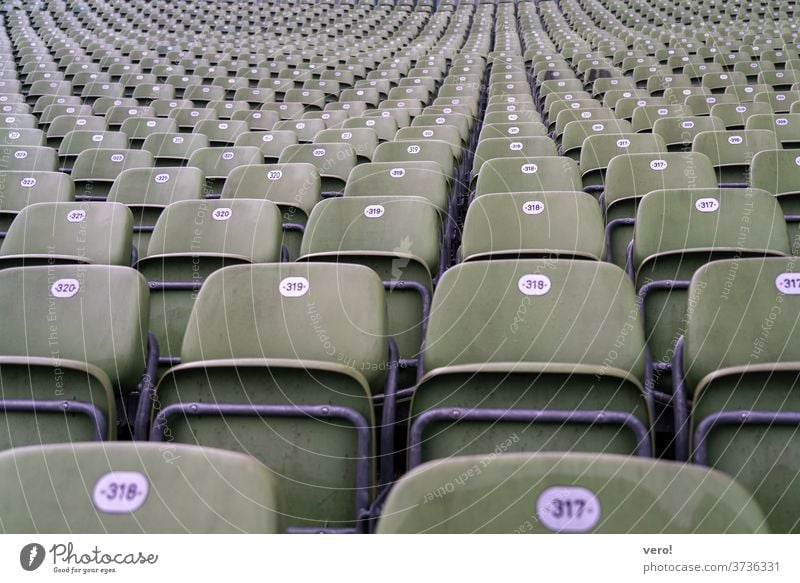 Armchair grandstand Downward Tall empty plastic seats Maximum Many bucket seats greenish good view Perspective Observe Deserted Row of seats Loneliness Empty