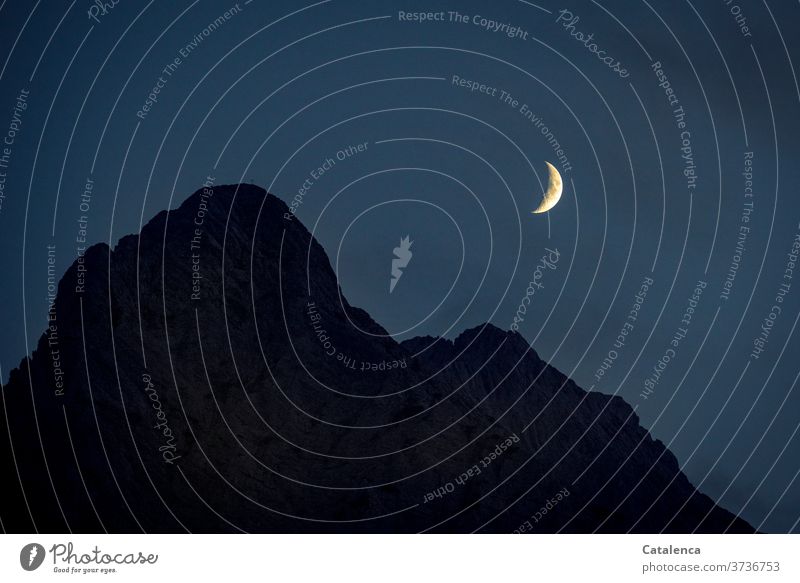 Moon over Wettersteinspitze mountain mountains Peak Night Sky Dark Evening Blue Yellow Black Night sky Rock outline