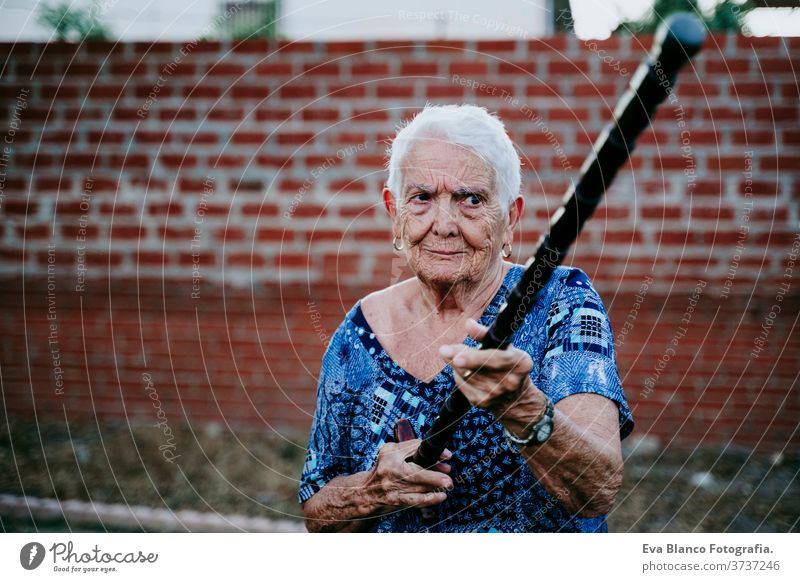 happy old lady smiling outdoors and having fun laugh joy woman portrait elderly home white hair grey hair mental grandmother aged health care looking emotion