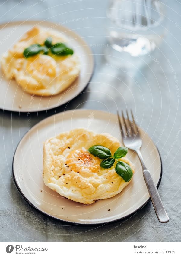 Fluffy Cloud Eggs fluffy eggs cloud eggs trendy food oven bake scrambled whipped white whole yolk plate sunny-side up eggs fried egg sunny side up vertical