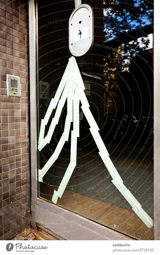 Repaired glass door Architecture front door Adhesive tape adhesive tape Pane broken Broken fragmented Glass door Entrance Berlin office city Germany