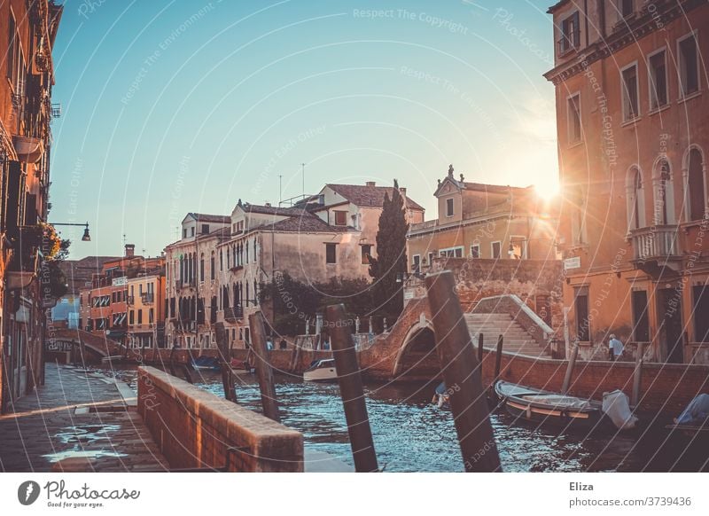 Another canal in Venice with boats and bridges and this time also with the sun between two houses Channel romantic Sun Back-light tawdry Picturesque