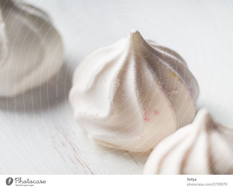 White meringue macro on wooden board white food winter texture birthday art cake dessert gourmet pastry plate dish homemade sweet color cook bake candy eating