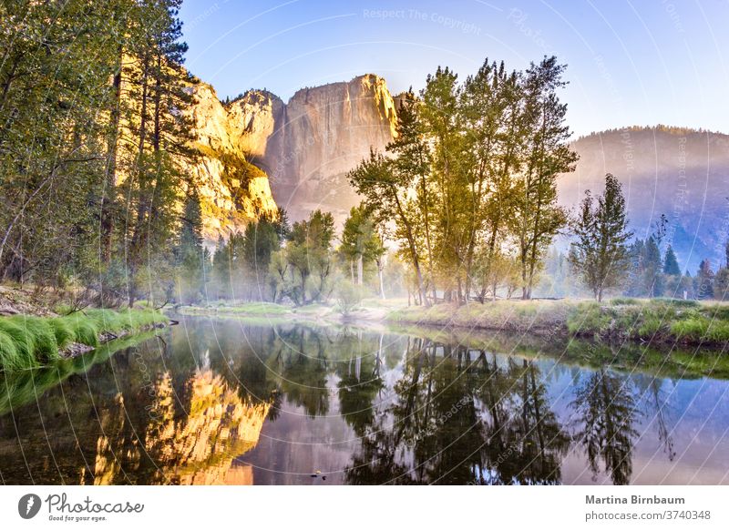 El Capitan reflecting in a lake in the morning short after sunrise, Yosemite National Park, California USA california orange golden park national usa yosemite