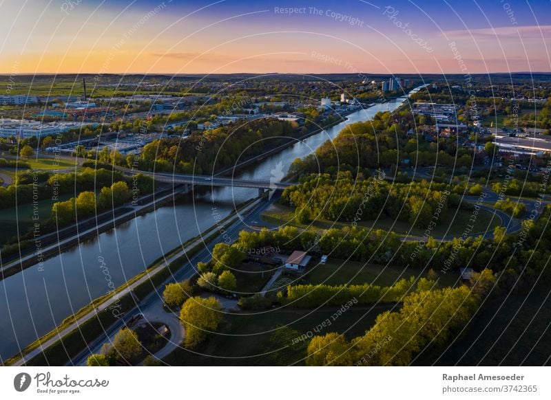 Aerial view of Rhine Main Danube Canal Erlangen aerial architecture city erlangen urban sunset europe canal river blue building cityscape colorful dusk green