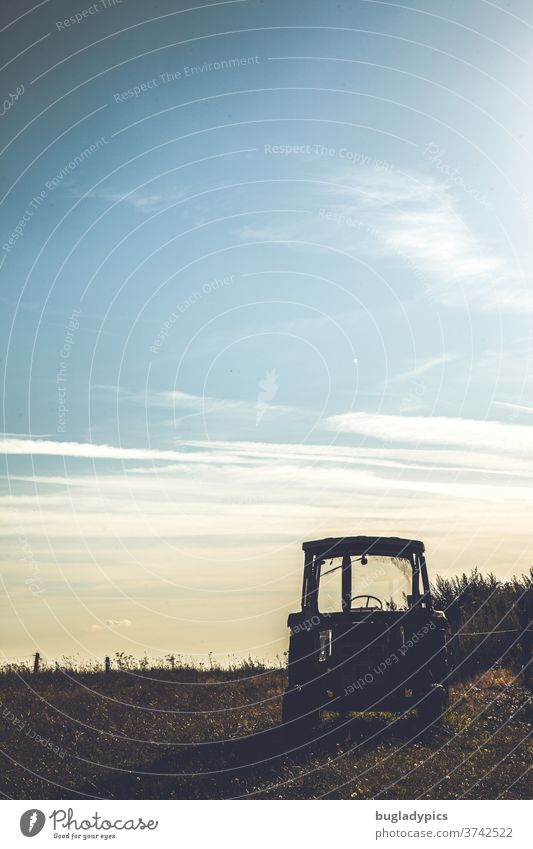 Tractor/ tractor against the light of evening skies with light clouds. Meadow Evening Dusk Evening sun evening sunlight Back-light Sunset Light Sky Nature