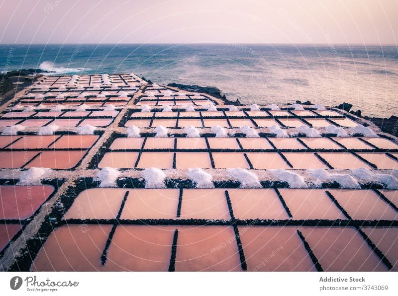 Pink salt ponds near the ocean pink lake seaside coast town aerial water marsh shore spain mallorka landscape beach travel nature destination picturesque