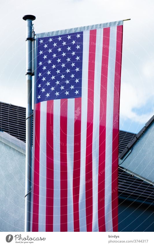 US national flag in front of a building. USA Flag Americas Ensign American Flag Flagpole full-frame image Patriotism Sky House (Residential Structure) Stripe