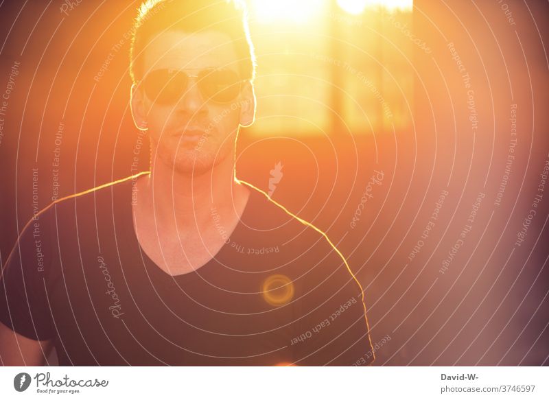 Man with sunglasses in sunlight Back-light Human being sunshine Cool (slang) Sunbeam portrait Illuminate enlightenment Easygoing Sunset