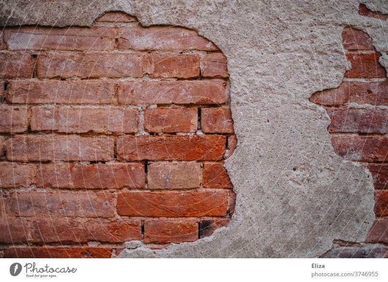 Red brick wall with crumbling plaster. Wall (barrier) Brick texture Firm Old in need of renovation Renovation Structures and shapes Brick wall Brick facade