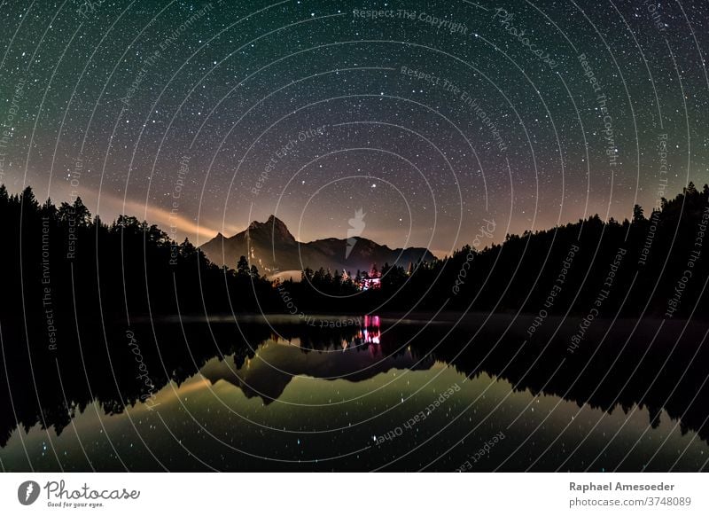 Night sky reflection in lake Urisee with alps mountains in background urisee stars reutte astro astronomy austria beautiful blue clear color colorful