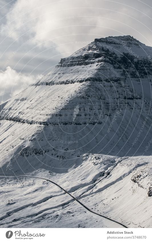 Snowy mountains on winter day snow cold nature landscape scenic sky ridge gray white weather scenery hill tranquil environment destination picturesque rock