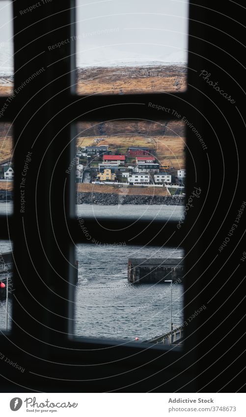 Small settlement in mountains on Faroe Islands village winter snow river season cold house residential faroe islands windows scenery breathtaking scenic