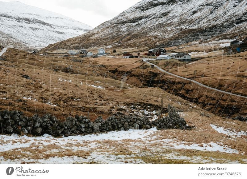 Wooden cottage on Faroe Islands on mountain village houses winter cold mountains nordic faroe islands travel coastal vacation famous place tourism