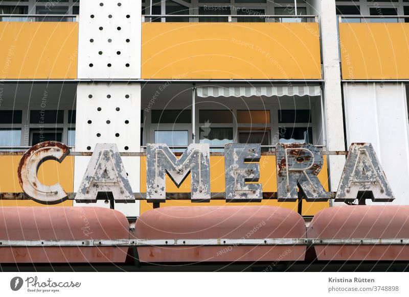 camera - old rusty neon signs in front of the house illuminated letters Letters (alphabet) neon advertisement illuminated sign fluorescent tube typo typography