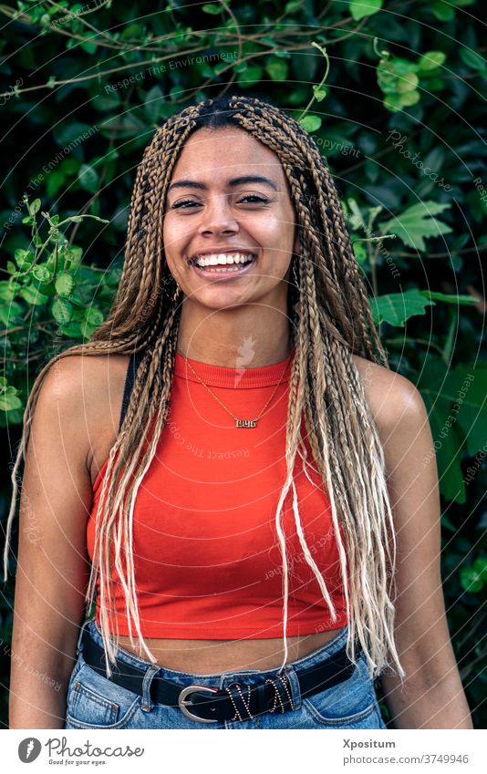 Portrait Girl With Braids portrait girl african girl wall looking at camera pretty background one person front view african american braids street attractive