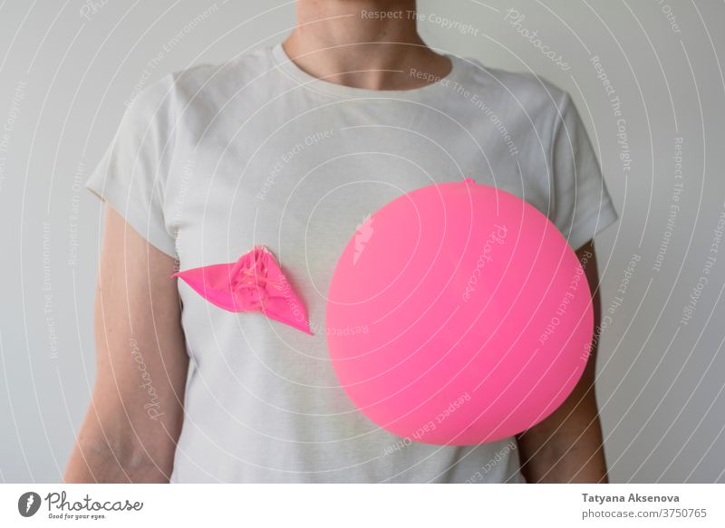 Woman with balloons on her breasts awareness cancer health pink female woman support care symbol disease charity help illness hope healthcare medicine campaign