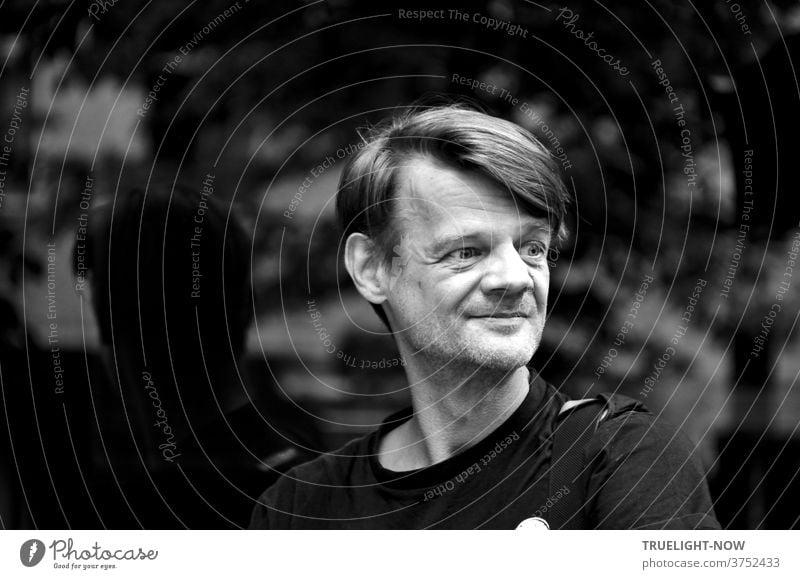 Tim Trzoska, a native Berliner with more heart than his snout and a sensitive photographer with an eye for the transience of his city, art director, author of photo books and videos here in front of a shop window in Prenzlauer Berg