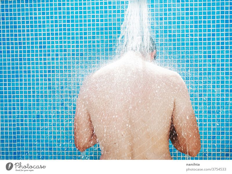 Young man having a shower before pool summer attractive white caucasian tan real real people real man candid fresh freshness cool coolness body real body