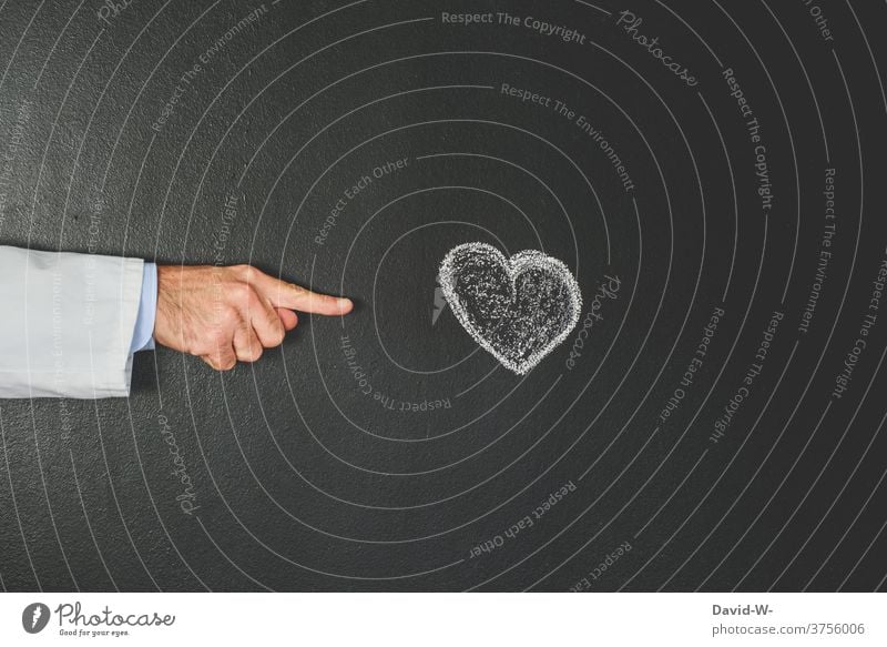 Doctor points to a heart Heart Cardiologist cardiology Indicate Interpret heart attack Healthy medicine Illness Health care