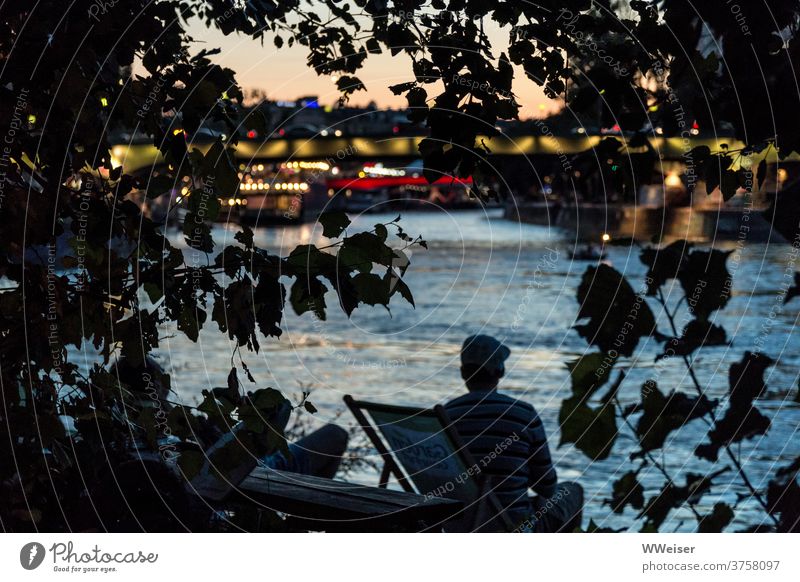 On the banks of a big river you can experience a romantic sunset in the middle of the city Beach bar deckchairs Evening clearer City Vienna Herrmanns