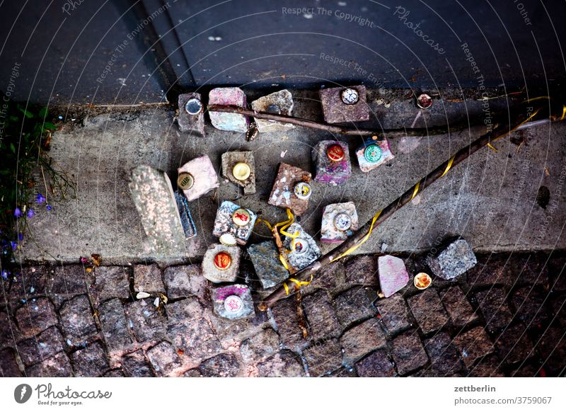 Adults see paving stones with crown caps; no idea what children see Stone Cork Crown cork game Children's game Sidewalk symbol free time Joy Fantasy fantasy