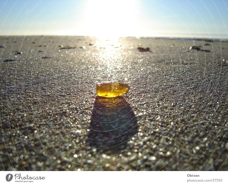 amber Lake Multiple Back-light Yellow Horizon Amber Ocean Beach Glittering Light Sky Shaft of light Radiation Beige Splendid Amber coloured Sandbank Coast Stone