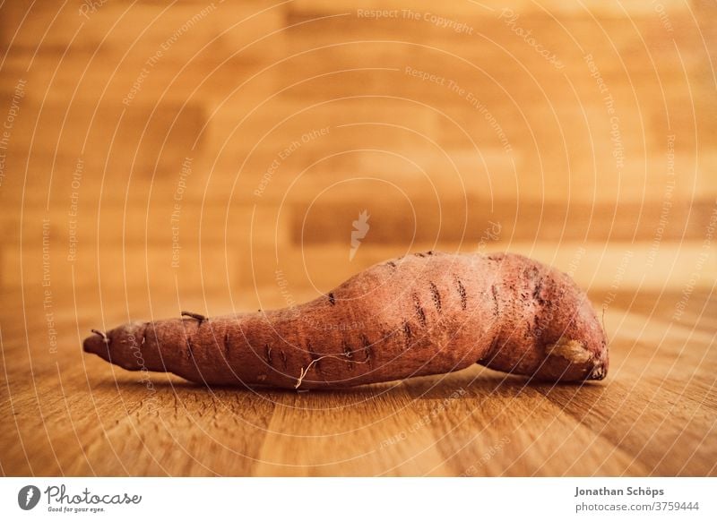 sweet potato still life close-up in front of wood Harvest thanksgiving Thanksgiving Vegetable Autumn wooden background Wooden table food Holiday season