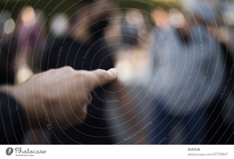 hand points with index finger at completely blurred person - point with finger at someone by hand Indicate Forefinger Blur Human being shallow depth of field