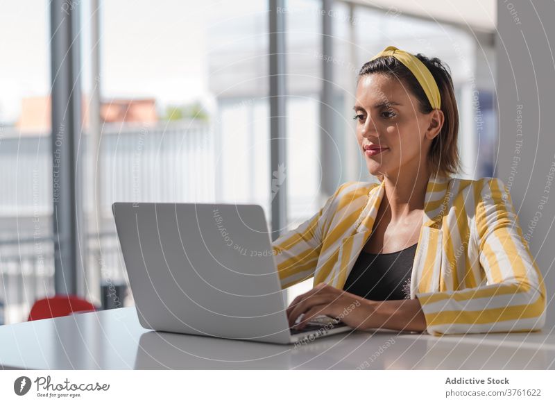 Young woman in trendy wear using laptop at home pregnant style work workplace remote freelance positive busy female browsing internet device gadget online job