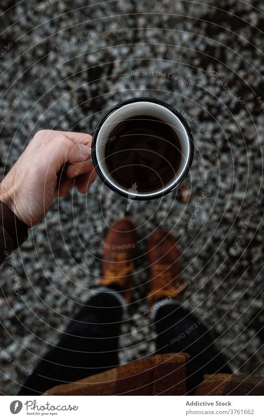 Crop traveler drinking coffee in metal cup tourist hot drink adventure scottish highlands scotland uk united kingdom mug vacation fresh breakfast nature aroma