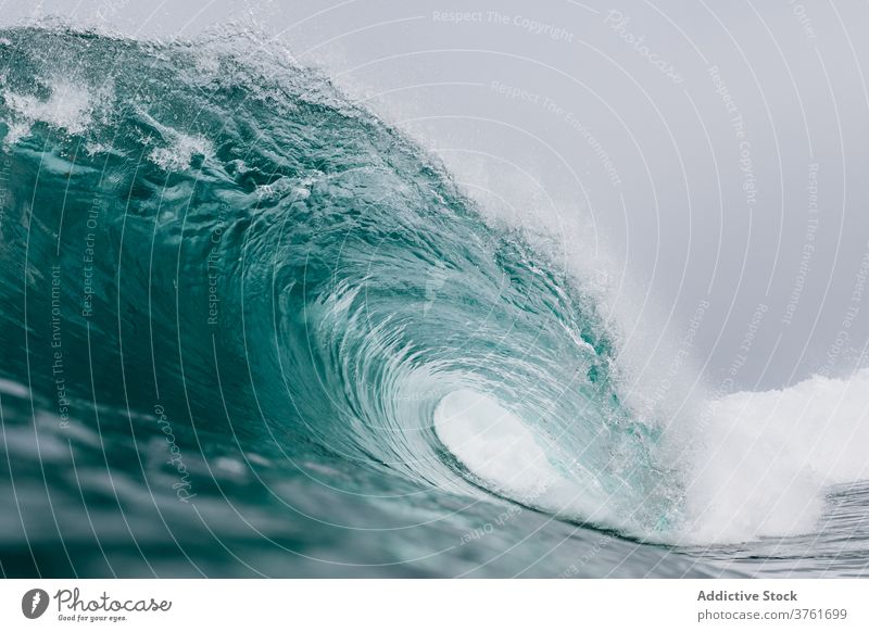 Stormy turquoise sea with waves ocean power water nature landscape blue seascape coast surf tropical crest summer splash white foam seashore surface storm wet