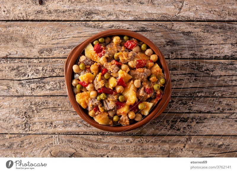 Ropa vieja food in bowl on wooden table. Top view ropa vieja beef spanish latin america chickpea brown cuban cuisine delicious dinner dish fried homemade