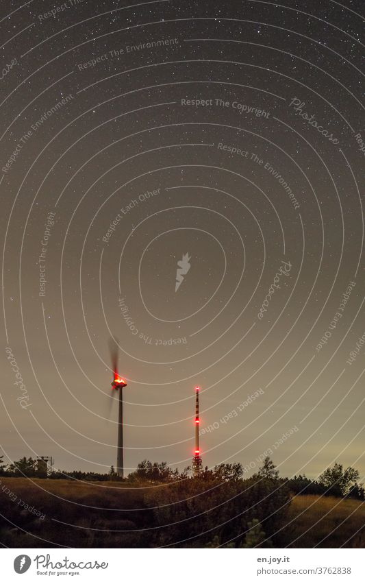 Wind turbine and transmission tower at night Pinwheel radio mast Transmitting station broadcasting tower Night Night shot Starry sky Hornisgrinde Black Forest