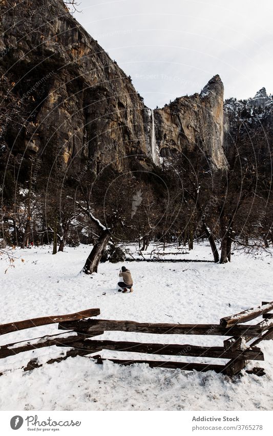 Lonely traveler in mountains in winter valley snowman highland nature season cold usa united states america landscape hill tourist scenic tourism entertain