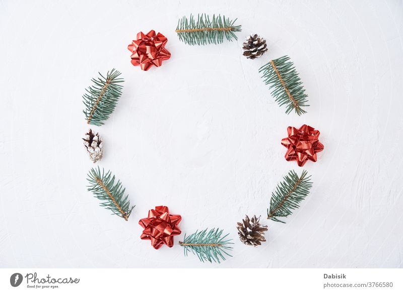 Christmas composition. Wreath made of fir tree branches and festive pine cones on a white background, top view christmas xmas decoration wreath holiday new year