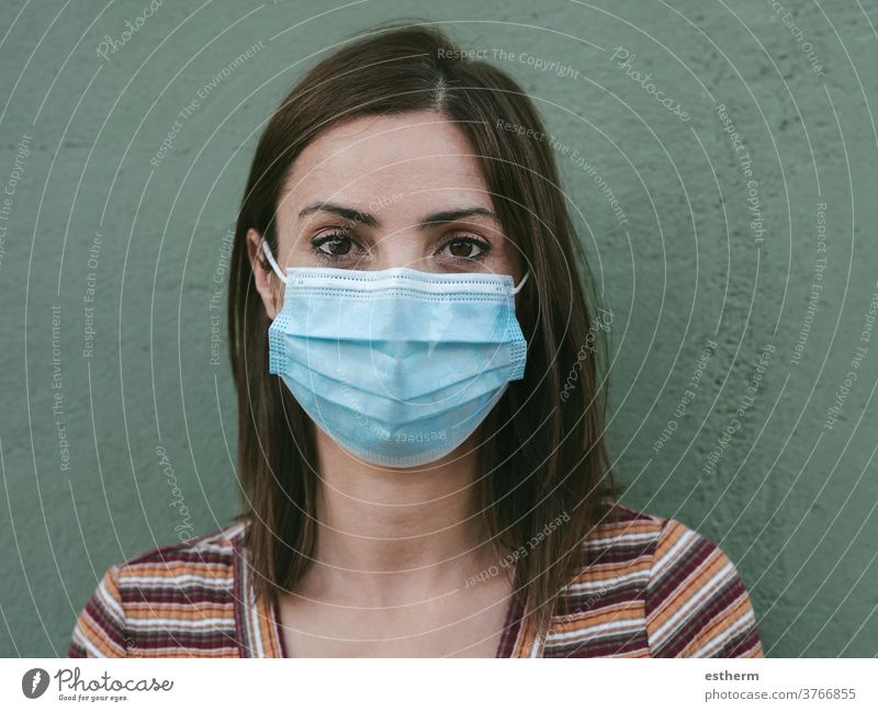 Close-up of young woman with medical mask coronavirus epidemic pandemic quarantine covid-19 symptom medicine health background blur positive test hospital city