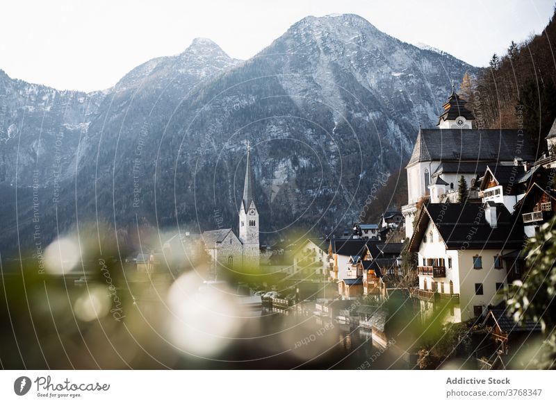 Small coastal town on mountain slope in autumn day rock shore building settlement house church architecture landscape countryside scenery calm peaceful majestic