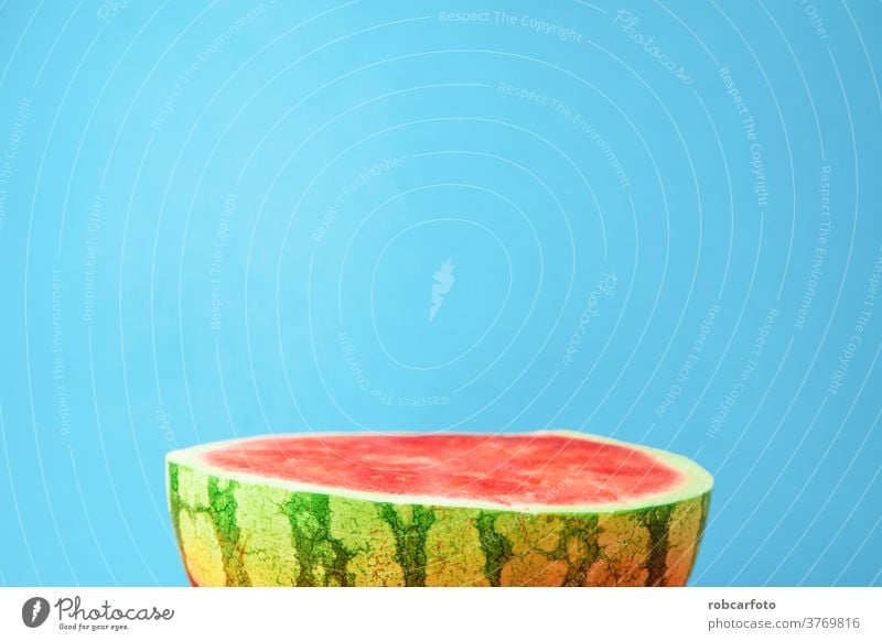 blue background with delicious watermelon open in half fresh juicy healthy food nature green organic diet red summer fruit pulp sweet dessert vitamin ripe part