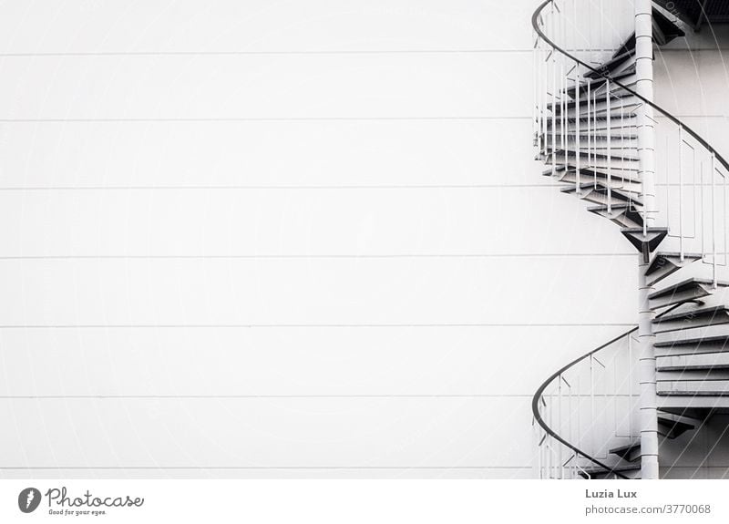 To the top or the poetic view of a fire escape on an industrial building upstairs daintily Graceful Curved Stairs Ladder Emergency emergency ladder Handrail