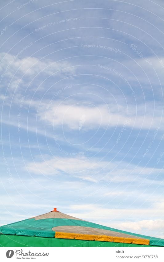 Sloping roof of the circus tent, in front of a blue sky. Circus Circus tent Tent Tarpaulin Roof tent roof Above Partially visible copyspace copy space